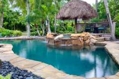Pastel Boulder water feature on spa with Crazy Horse Flagstone Coping.